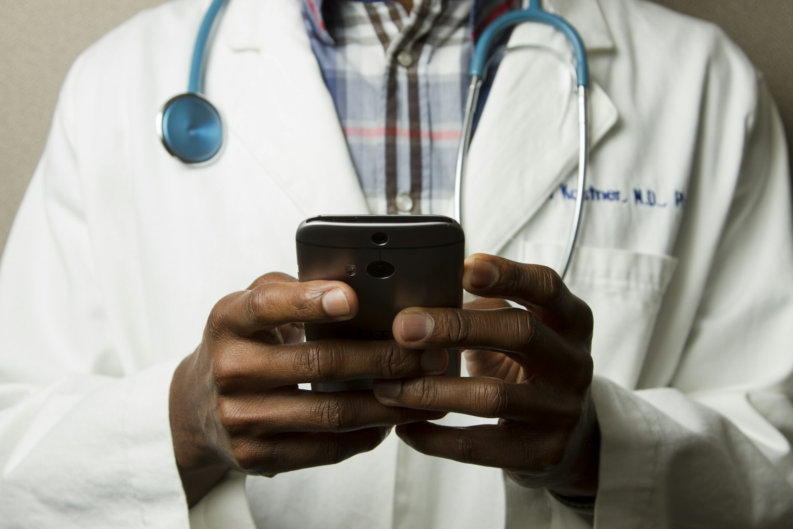 Healthcare professional using a smartphone for telehealth
