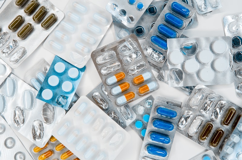 Pharmacist consulting with a customer about prescription drug pricing options