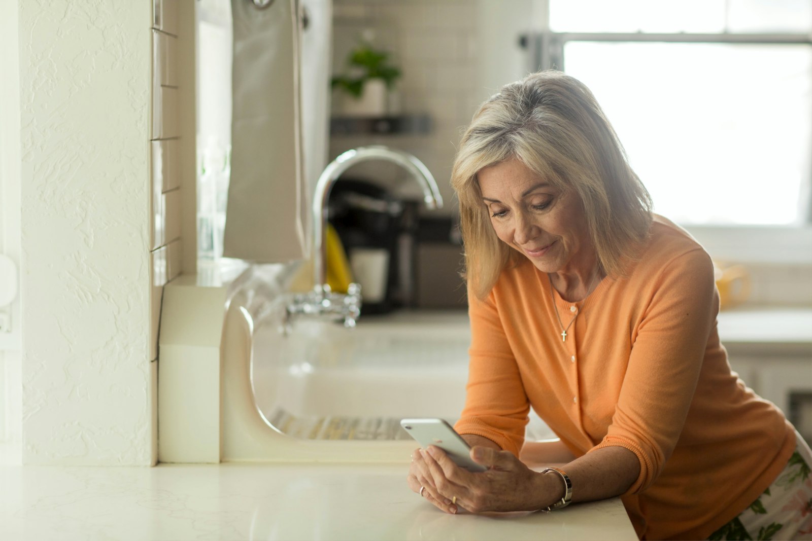 Person using a pharmacy discount card app on a smartphone