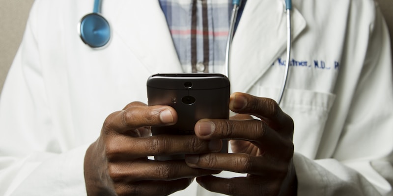 Doctor reviewing medication options with a patient in a clinical setting